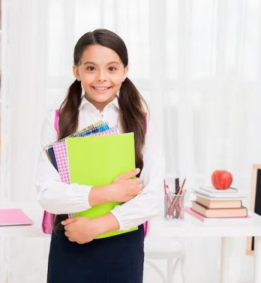 cute-schoolgirl-uniform-holding-notepads-classroom_23-2148224862